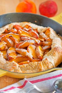 Juicy fresh peaches are baked in a delicious, flaky crust for this super easy Peach Skillet Galette that is baked in your favorite cast iron skillet.