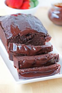 Chocolate Pound Cake sliced and topped with chocolate ganache