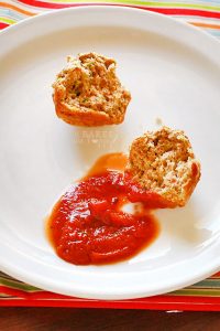 Sprinkled with Parmesan on top these little zucchini cheese bites are soft, hearty and satisfying and perfect with a side of marinara sauce!